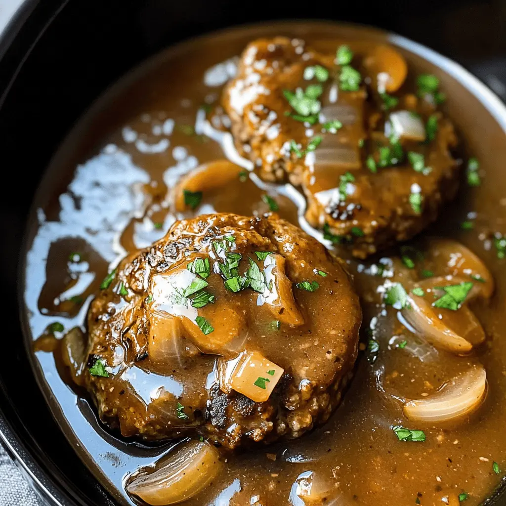 Comfort food at its best! This Slow Cooker Salisbury Steaks recipe features juicy beef patties smothered in a rich mushroom gravy. Perfect for busy weeknights or Sunday dinner, this meal is both hearty and satisfying. Don’t forget to save this recipe for when you want an easy, delicious dinner that the whole family will love!