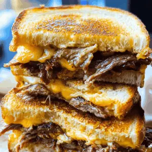 Warm up your taste buds with this mouthwatering Smoked Brisket Grilled Cheese! Packed with tender smoked brisket and ooey-gooey cheese, it's the ultimate comfort food. Perfect for game day or a cozy night in, this easy recipe is sure to impress. Save it for your next gathering and elevate your grilled cheese game!
