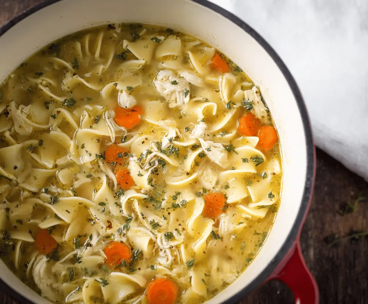 Creamy and comforting CopyCat Panera Bread Chicken Noodle Soup with tender chicken, vegetables, and flavorful broth in a bowl