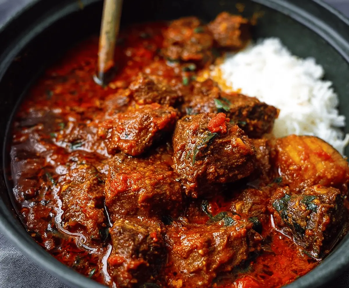 Delicious Nigerian beef stew with tender meat, vibrant vegetables, and rich spices, perfect for sharing and enjoyed with rice or bread