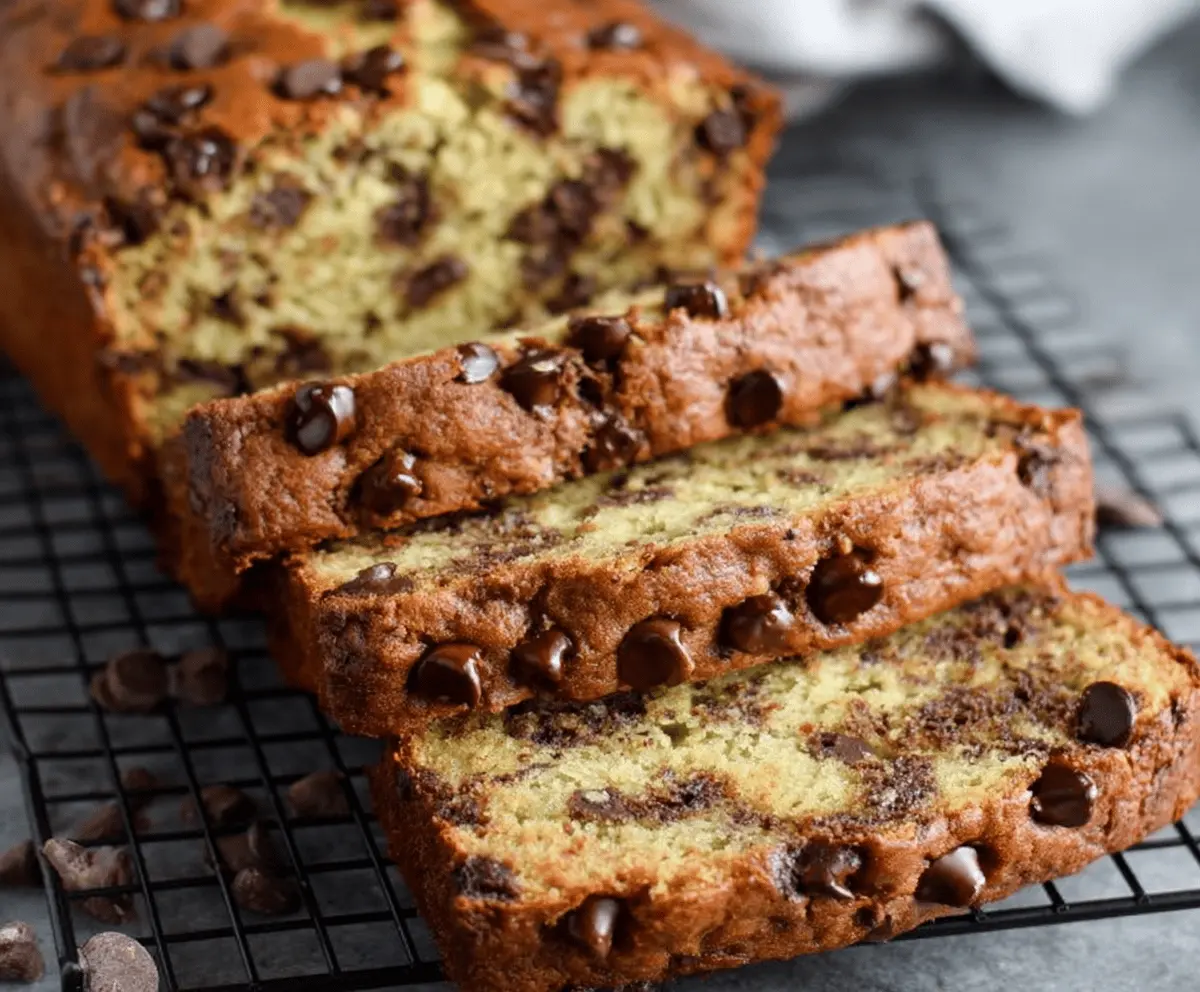 Delicious super moist chocolate chip banana bread with golden crust and gooey chocolate chips, perfect for a sweet snack or breakfast