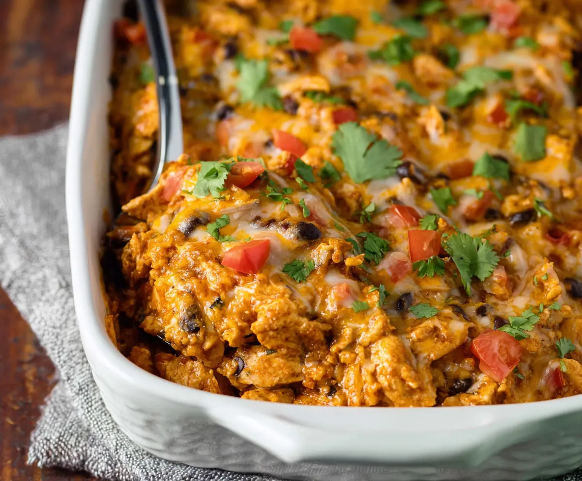 Delicious Mexican Chicken Casserole with melted cheese and flavorful spices, perfect for a hearty meal.