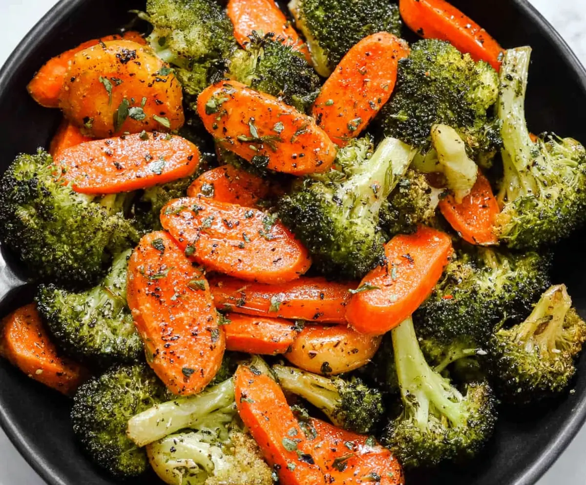 Delicious roasted broccoli and carrots served as a healthy vegetable side dish.